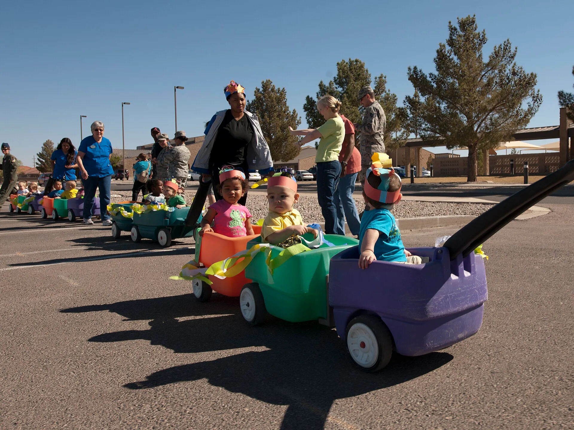 Infants from Holloman's Child Development Center ride in a stroller during a march to commemorate the start of the 2012 Month of the Military Child April 6. The CDC's 31 staff members provide a safe, educational and cost-effective daycare environment for more than 80 children daily, ranging in age f. Halifax and St. John's Daycare Staffing Under $10-a-Day