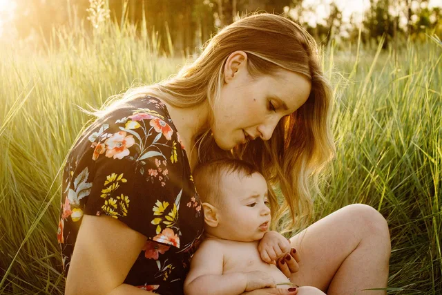 mother, baby, child, field, motherhood, parent, parenthood, infant, family, girl, grass, love, woman, sit, sitting, outdoors, nature, portrait, happy mothers day, golden light, mum, mom. Childcare referral channels compared with paid ads for new families