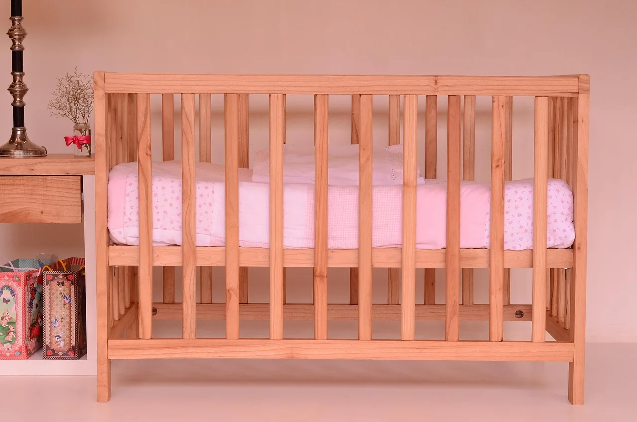 crib, baby bed, baby cot, cot, bed, infant cot, furniture, wood, carpentry, crib, crib, crib, crib, crib, baby bed, baby bed, baby cot, cot, cot. Childcare center equipment on a budget: used versus new